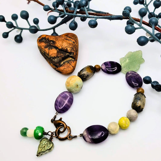 Unleash your love of nature with this Aventurine Leaf Bracelet, featuring the stabilizing energies of fluorite and amazonite. With an easy toggle and charming mushroom accent, this elegant bracelet brings the beauty of nature to your daily style.